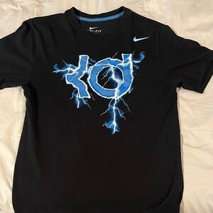 Nike Kids Black Tee with Blue Lightning Graphic